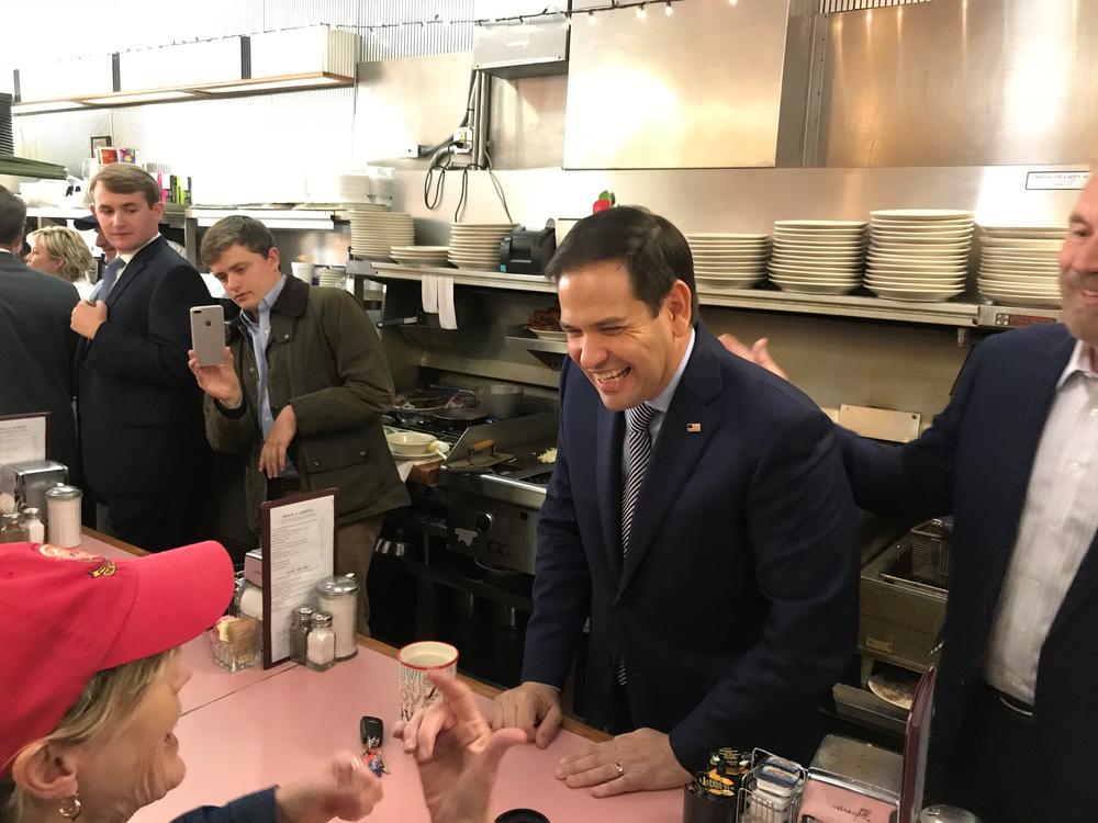 Florida Senator Marco Rubio chats with a patron at the White House restaurant in Buckhead.