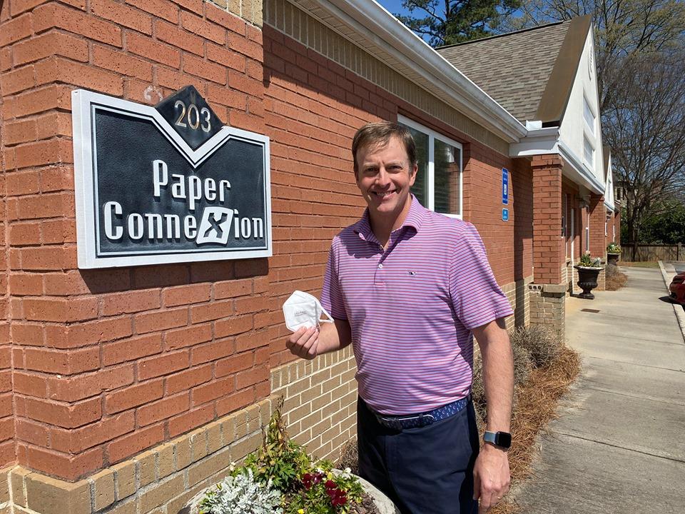 Ryan Casey of Marietta-based Paper Connexion holds a respirator mask he is selling through his new company, Safety Connexion.