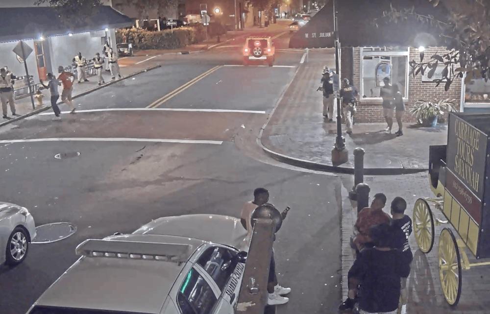 Savannah police swarm the scene shortly after a shooting in the city's downtown historic district on July 5, 2017.