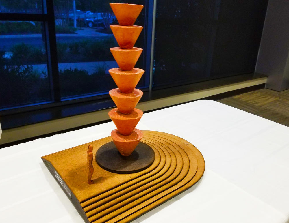 Thomas Sayre's sculpture proposal is a tower of 7 or 8 conical earth form casts, made in the Augusta area with local soil, that would stand nearly 30 feet tall.