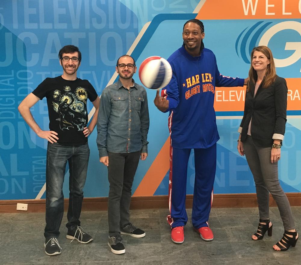 SCAD students Scott Kalison and Carlos Soler, Harlem Globetrotter Moose Weekes,  and Lee Todd, who oversees special projects at SCAD.