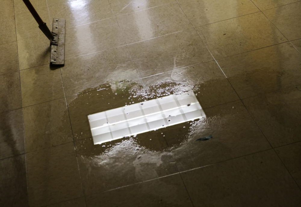 A puddle of water sits in the hall at Potter Street.