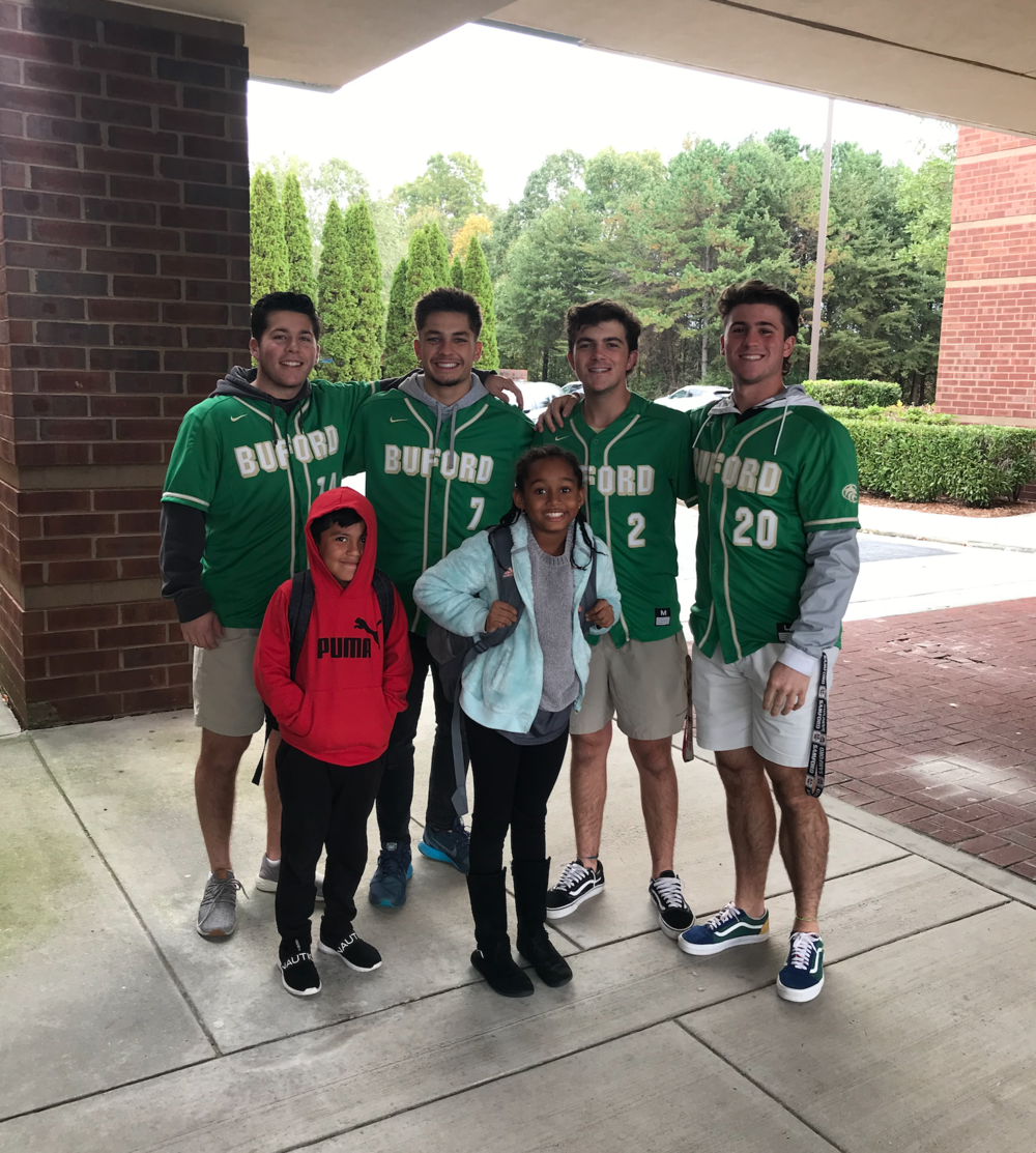 Buford senior pitcher Cooper Hardee (#2) pictured with teammates while helping raise money for a scholarship fund and local church feed the needy at Thanksgiving