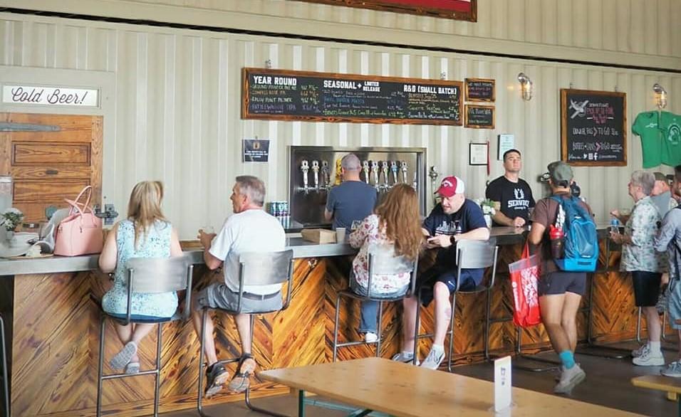 Customers enjoy beer at Service Brewing in Savannah. 