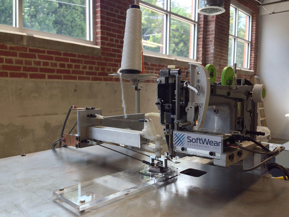 Robotic sewing machines, like this one created by SoftWear Automation, could change the garment industry and bring jobs back to Georgia.