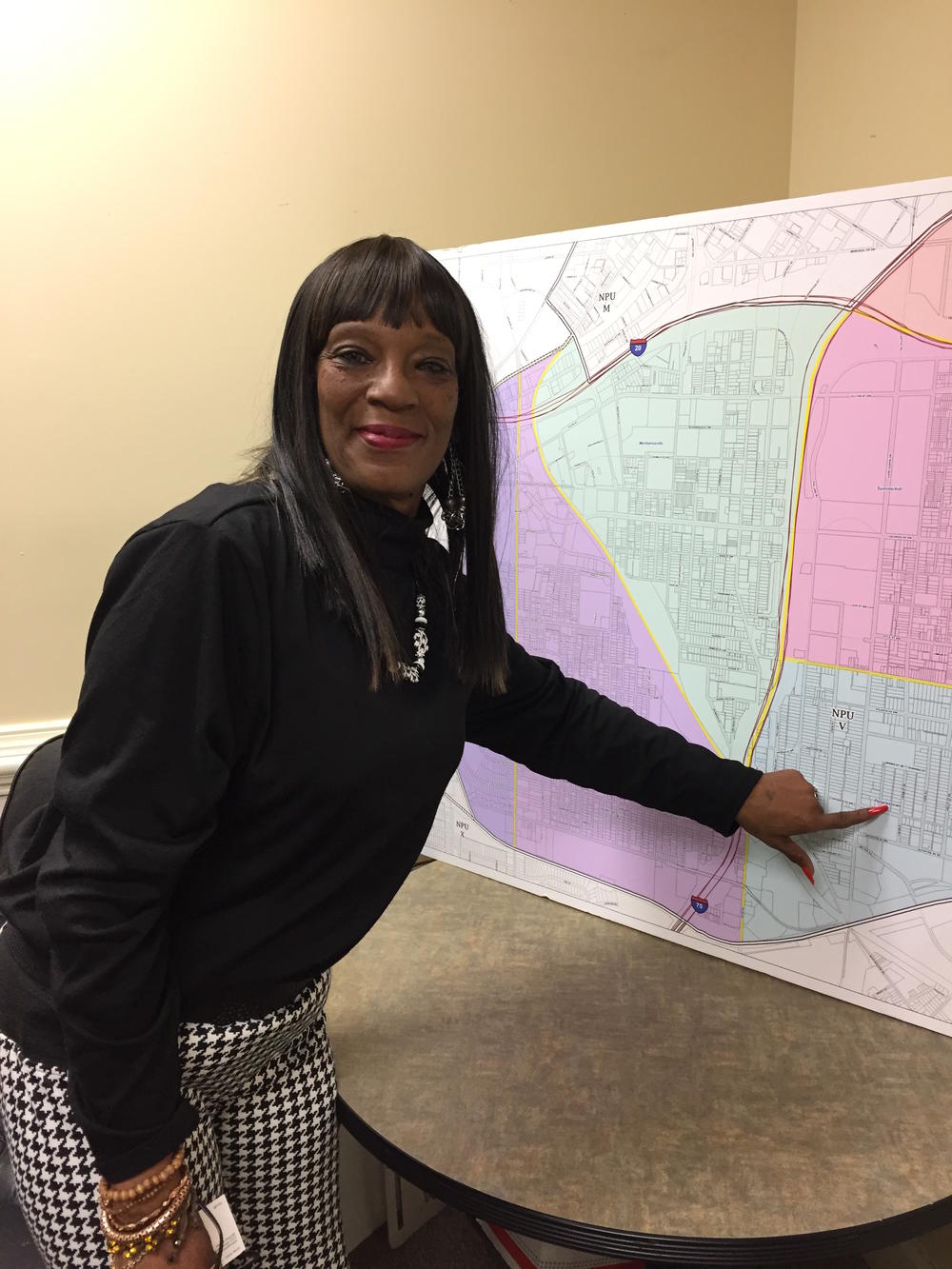 Summerhill resident Sharise Brown points to her home on a map of downtown Atlanta's NPU-V where Turner Field will be redeveloped. 
