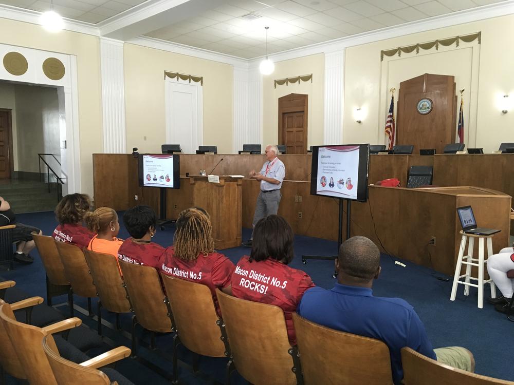 Red Cross trainer Gaines Harman trains volunteers in Macon Government Center.