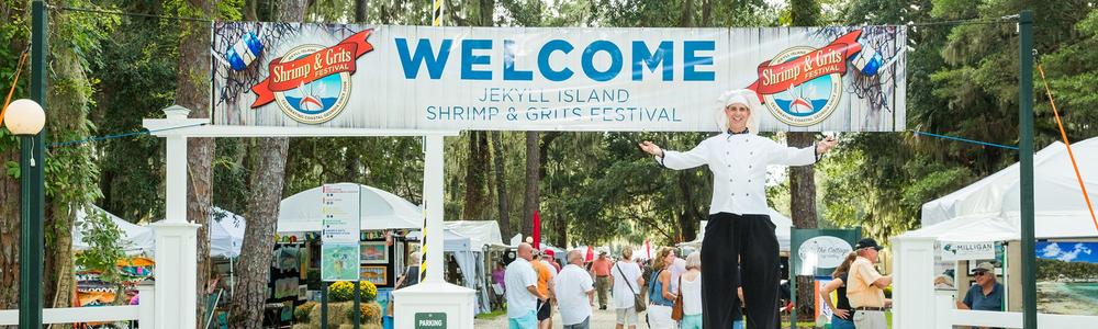 A participating chef welcomes guests into the Jekyll Island Shrimp and Grits Festival.