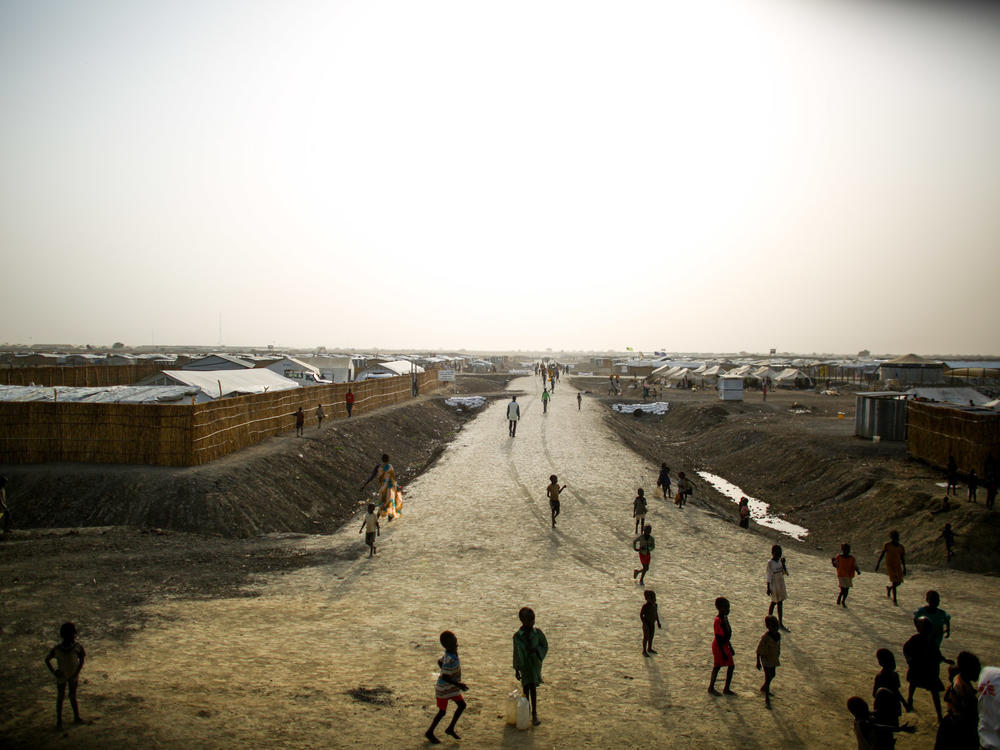 A dirt road cuts through a sprawling Doctors Without Borders camp in South Sudan. In a letter, 1,000 current and former employees are accusing the aid group of racism and white supremacy.