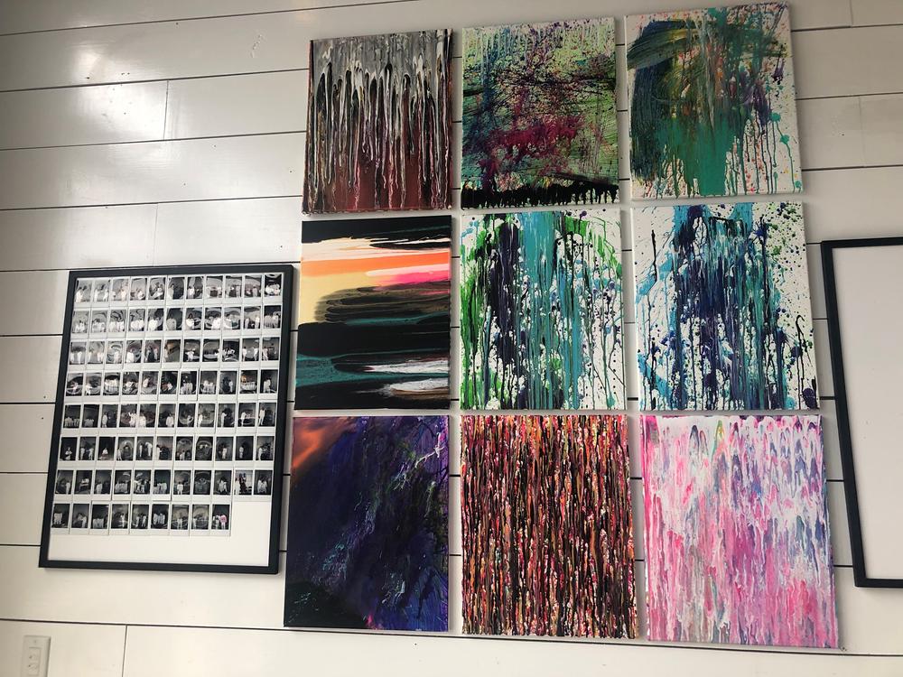 Paintings hang on the wall inside the 'Splatter Room' to show the unlimited ways someone can be creative on a canvas. 