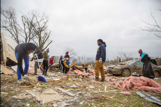 Neighbors and family pick through debris for valuables and keepsakes in what was left of a Talbotton home.