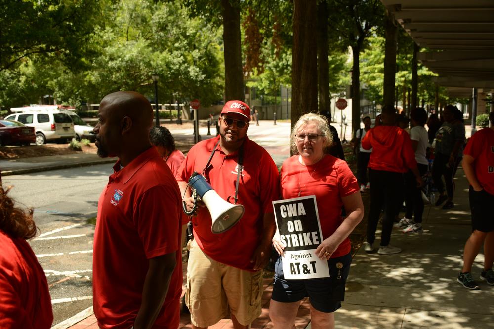 CWA Local 3204 president Ed Barlow is joined by a striking employee.