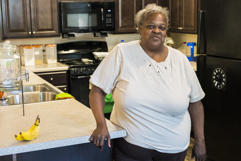 Annie Johnson in the kitchen of her new apartment in Tindall Senior Towers in Macon.