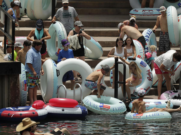 Tubers prepare to float the Comal River in New Braunfels, Texas, on June 26. Texas Gov. Greg Abbott said that the state is facing a 