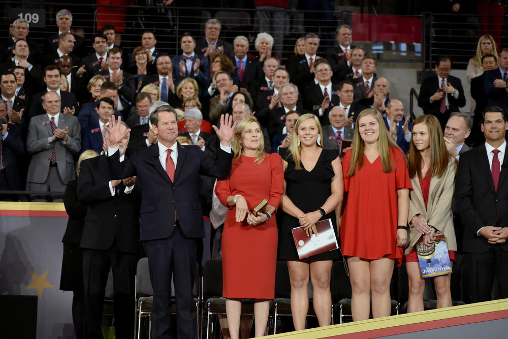 Governor Brian Kemp, wife Marty, and daughters Jarrett, Lucy and Amy Porter wave during the inauguration events Monday, January 14, 2019 at Georgia Tech's McCamish Pavilion.