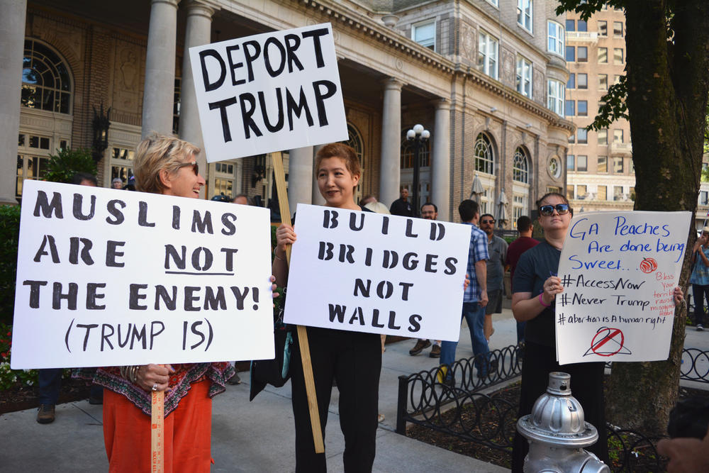 Protesters gathered across the street from the Fox Theatre in Atlanta where Donld Trump was speaking on Wednesday, June 15, 2016. 
