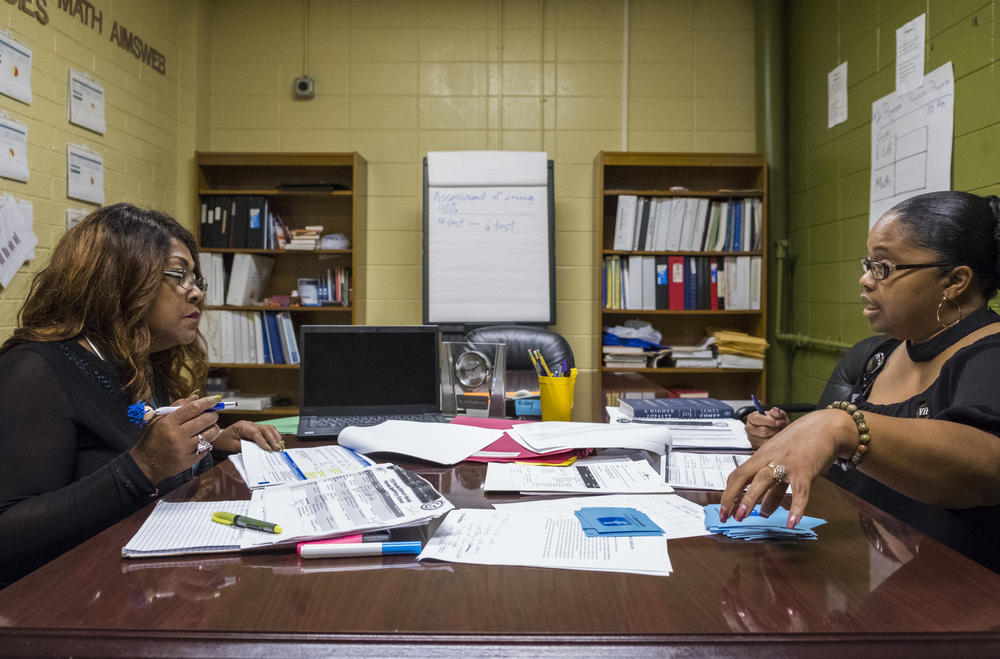 Betty Jones of the Chief Turnaround Office, left, and Principal Shandrina Griffin-Stewart going over progress in their shared plan for progress at Appling Middle School in Macon. 