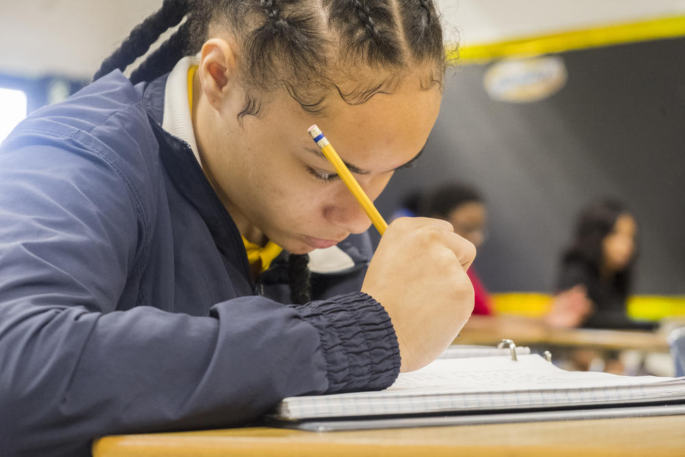 An Appling Middle School student writing during class. 