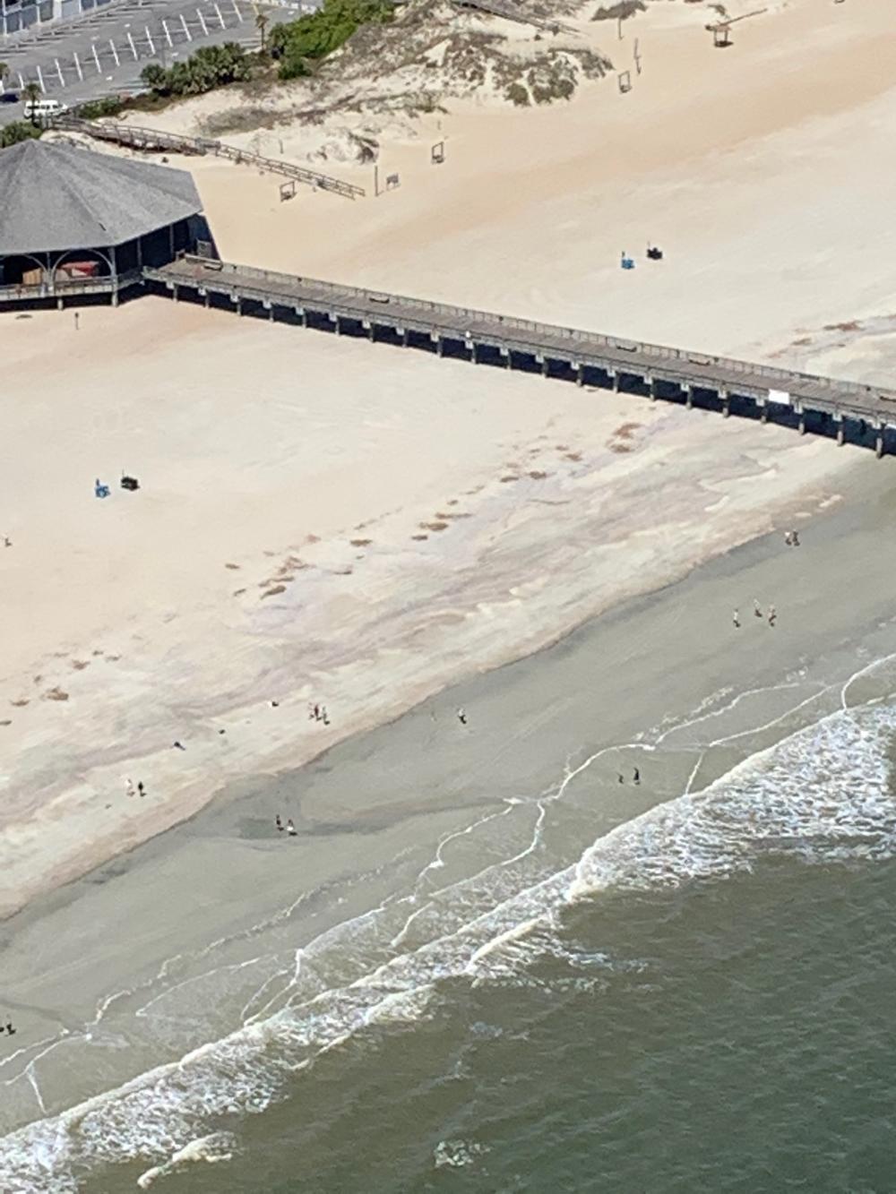 Gov. Brian Kemp shared this aerial photo in a tweet Saturday, saying most beachgoers were locals. But Tybee officials say with beaches reopened, they're now getting visitors from out of state.