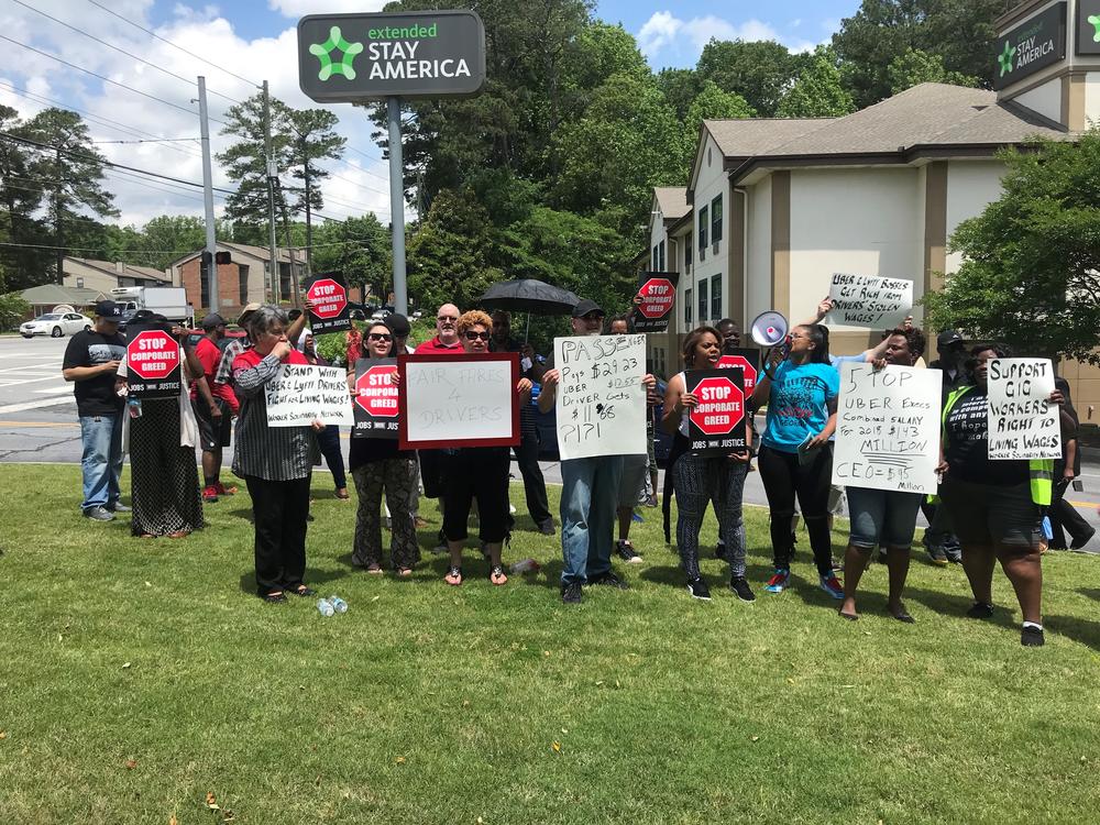 Uber and Lyft drivers in Atlanta participate in global protest against the rideshare companies ahead of Uber's IPO.