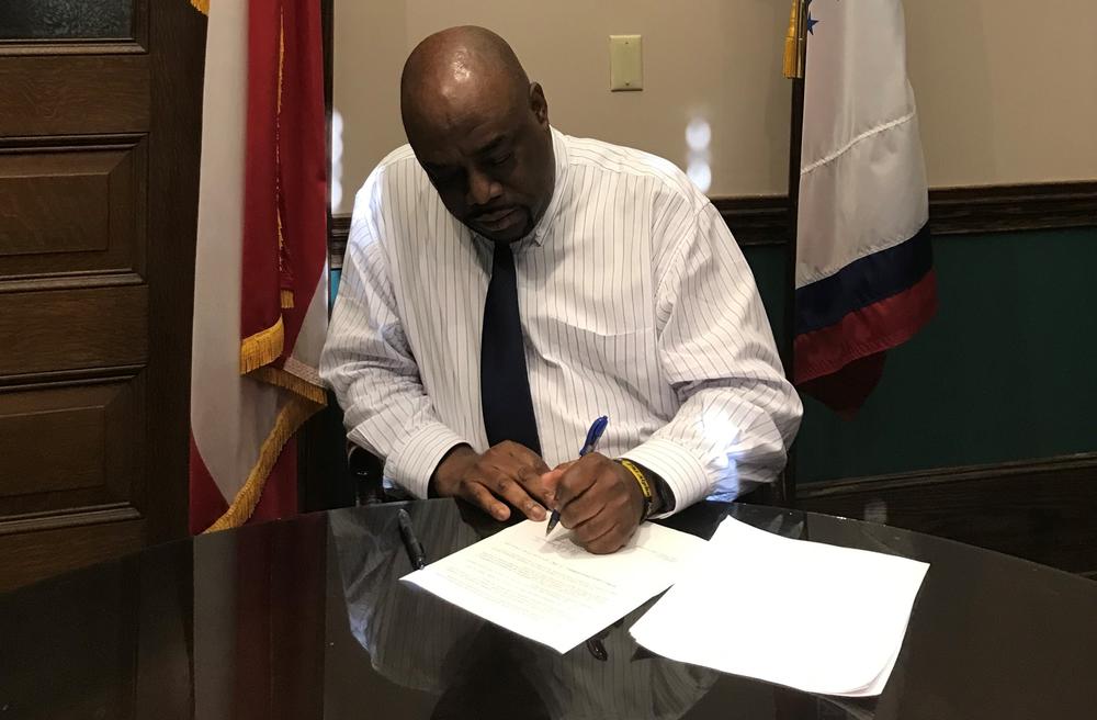 Savannah Mayor Van Johnson signs an emergency declaration ordering Savannah residents to stay home.
