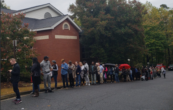 Voters wait in line at a polling place in Vinings.