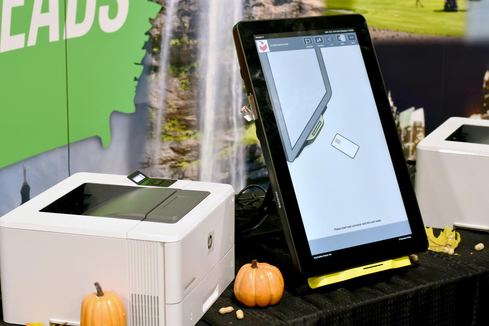 A Dominion ballot-marking device is set up at the Georgia National Fair in Perry. Voters will make their selections on the touchscreen machine, which will print out a paper ballot with a QR code and a text summary of the races and selections made.