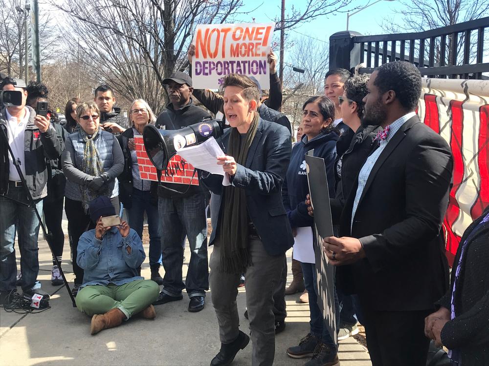 Stephanie Guilloud of Project South speaks at a rally against President Trump's declaration of a national emergency for border wall funding. 