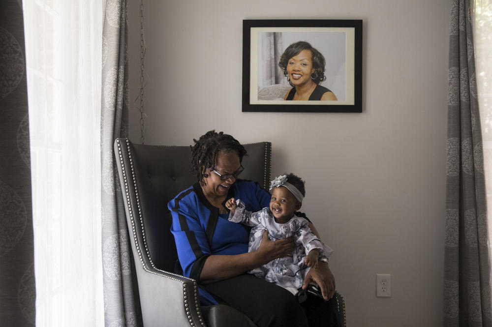 Wanda Irving holds her grandaughter, Soleil.