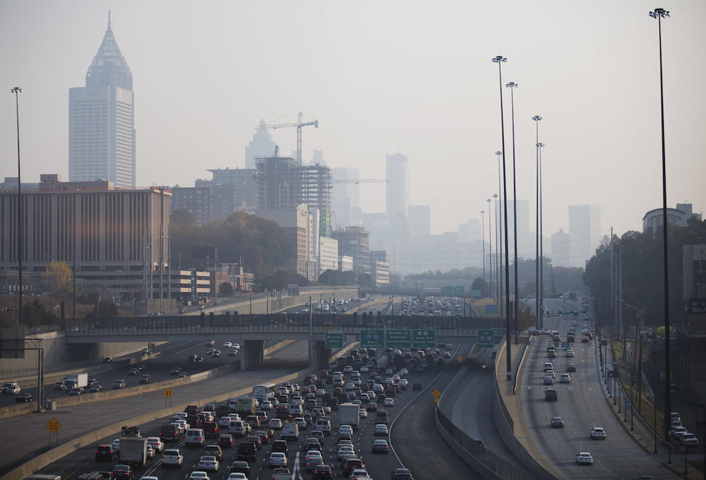 A haze hovers over the downtown skyline from a wildfire burning in the Northwest part of the state, Monday, Nov. 14, 2016, in Atlanta. Fires, many of them suspected arsons, have prompted evacuations in Georgia, North Carolina and Tennessee recently. 