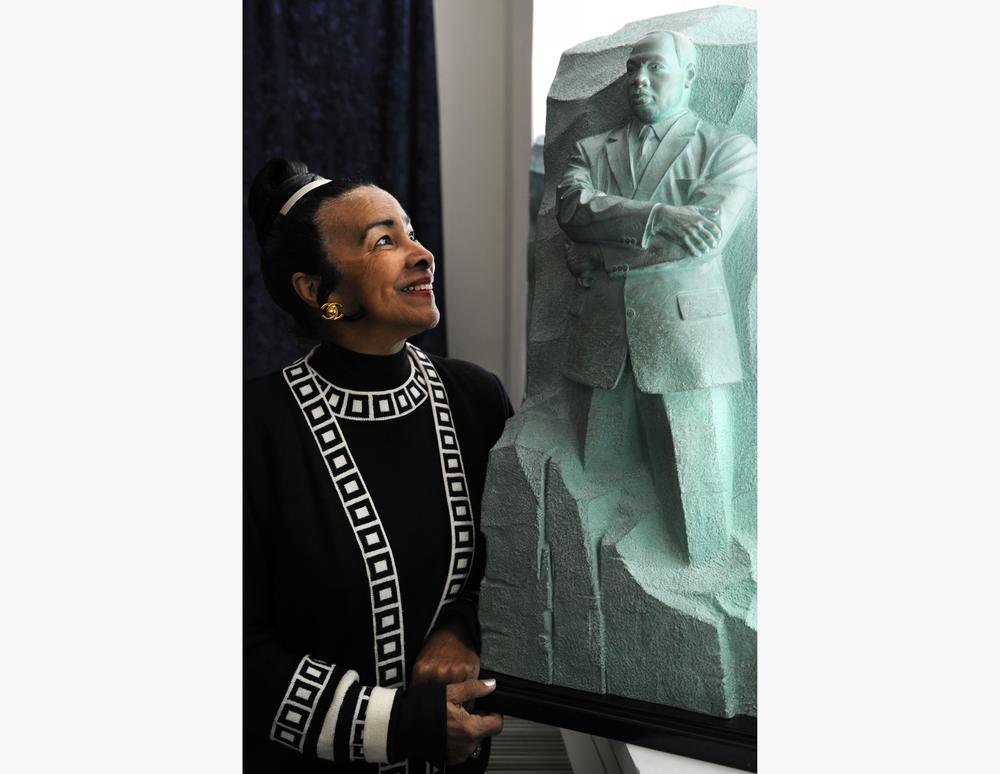 Xernona Clayton, who was a special assistant to Martin Luther King, Jr., looks at a model of the Stone of Hope, the centerpiece of the Martin Luther King, Jr. National Memorial Project.