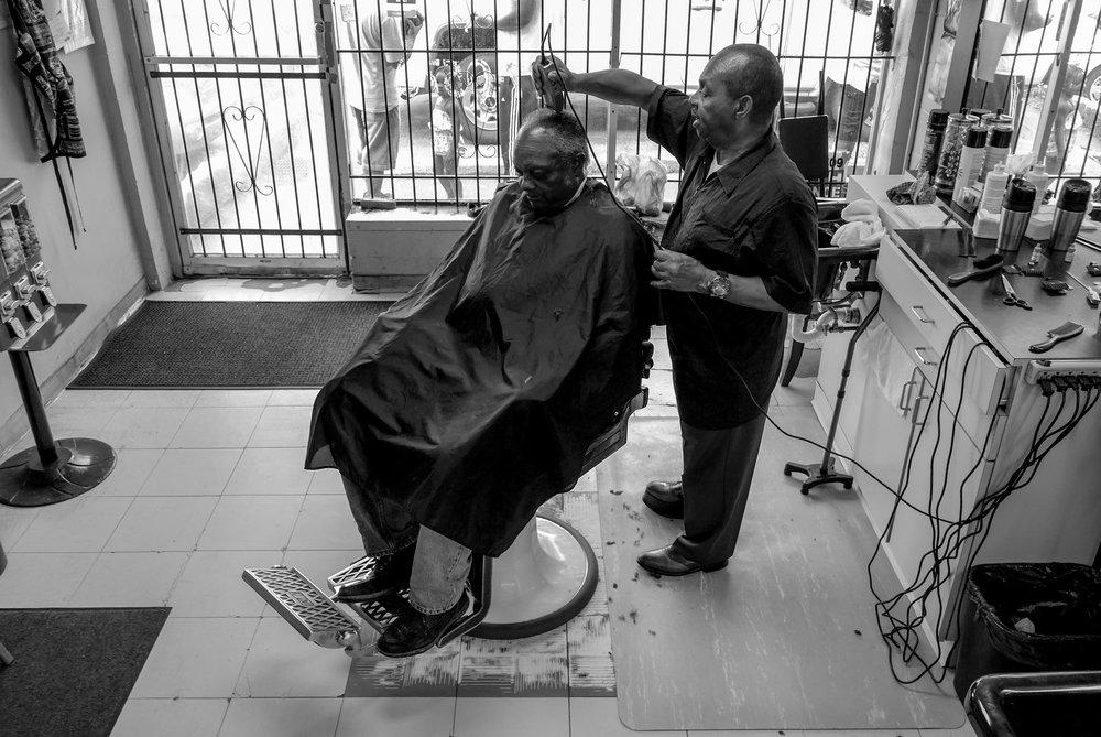 Antonio Johnson's series "You Next" captures the community and power of barber shops across America.