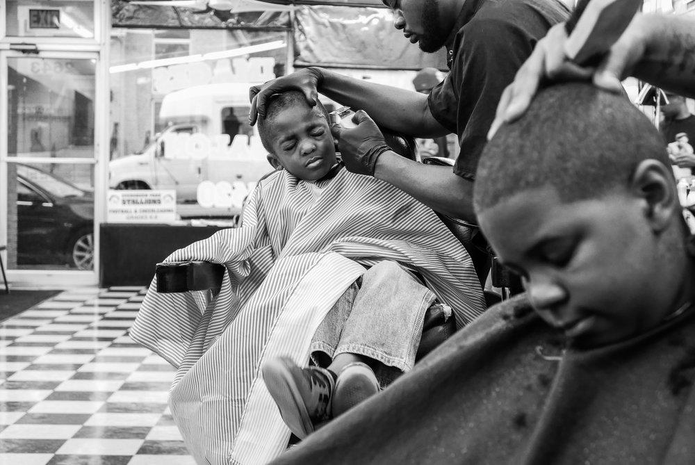 Antonio Johnson's series "You Next" captures the community and power of barber shops across America.