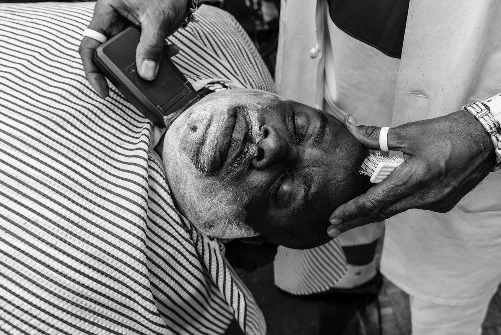 Antonio Johnson's series "You Next" captures the community and power of barber shops across America.