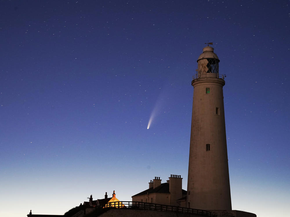 Comet Neowise passes St. Mary's Lighthouse in Whitley Bay, U.K., in the early hours of Tuesday morning.