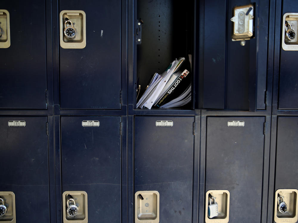 A locker sits open in April at Kent Middle School in Kentfield, Calif. Schools and parents are grappling with whether — and how — to reopen in the fall.
