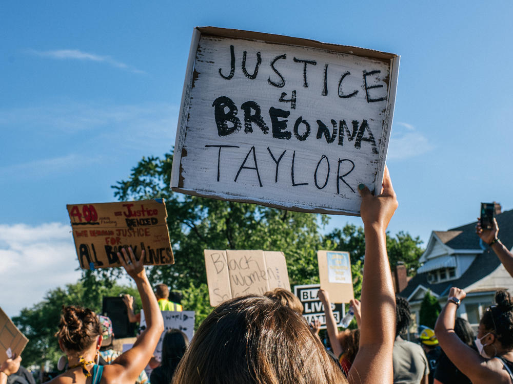 People march in the streets during a demonstration on June 26 in Minneapolis, Minn.  The march honored Breonna Taylor, who was shot and killed by members of the Louisville Metro Police Department on March 13.