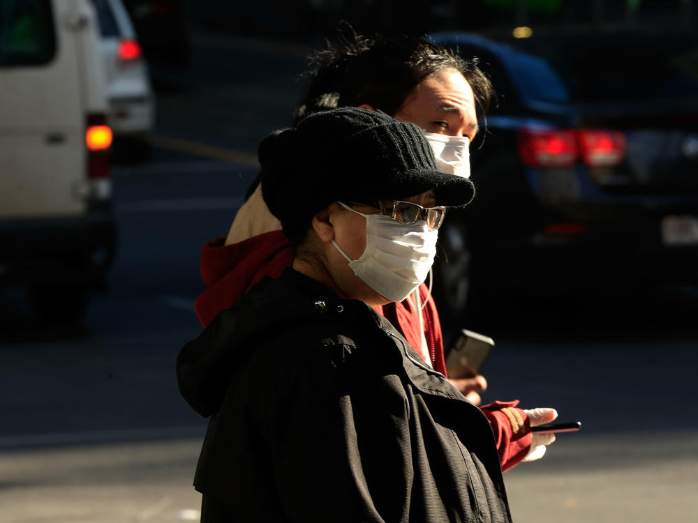 People in Melbourne, Australia, wearing face masks on Thursday. Victoria has recorded 317 new cases of coronavirus in 24 hours, the highest daily total recorded in the state since the pandemic began.