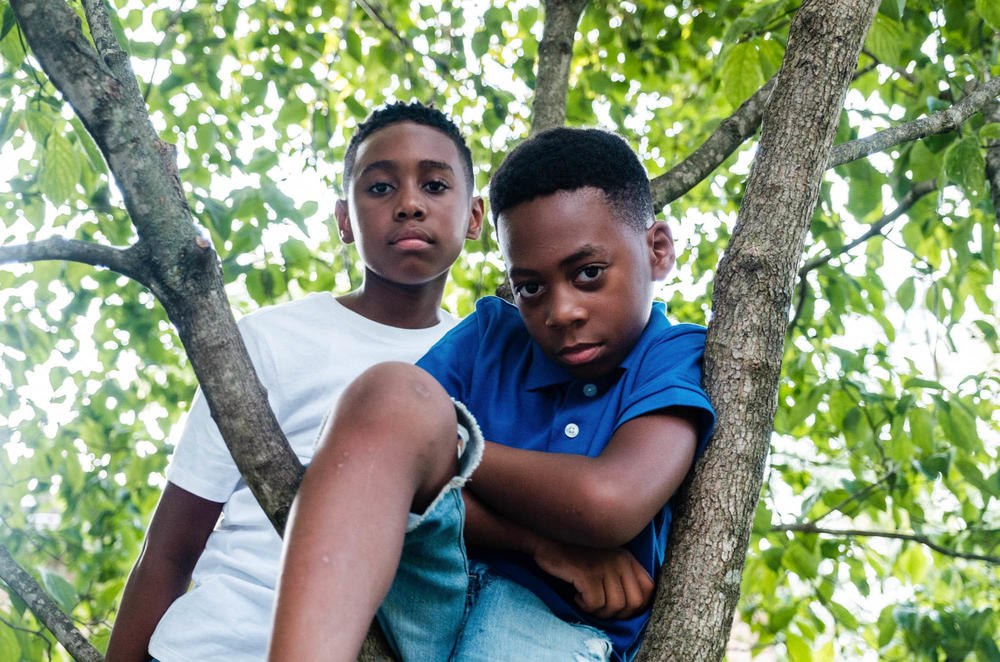 Rhea Roper Nedd says she and her husband teach their sons Christopher (left) and Noah to recognize the importance of changing narratives in society and recognizing that change is possible.