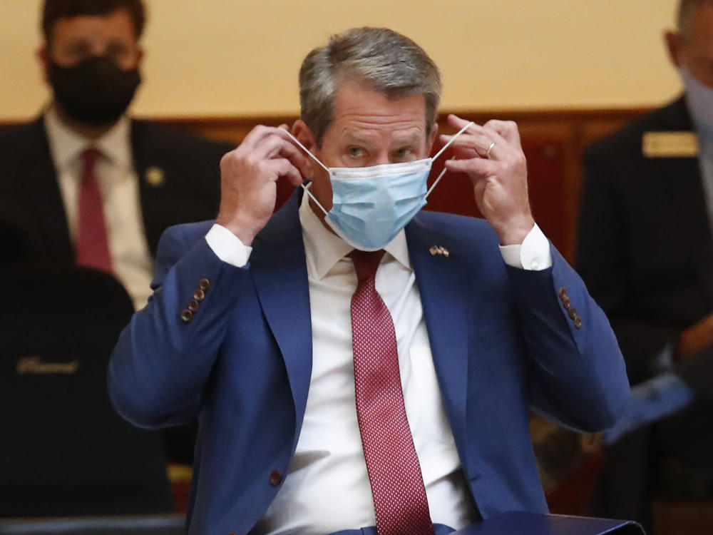 Georgia Gov. Brian Kemp gave a coronavirus briefing at the Capitol Friday, in Atlanta. Kemp has filed a lawsuit against the city over its face-mask requirement.