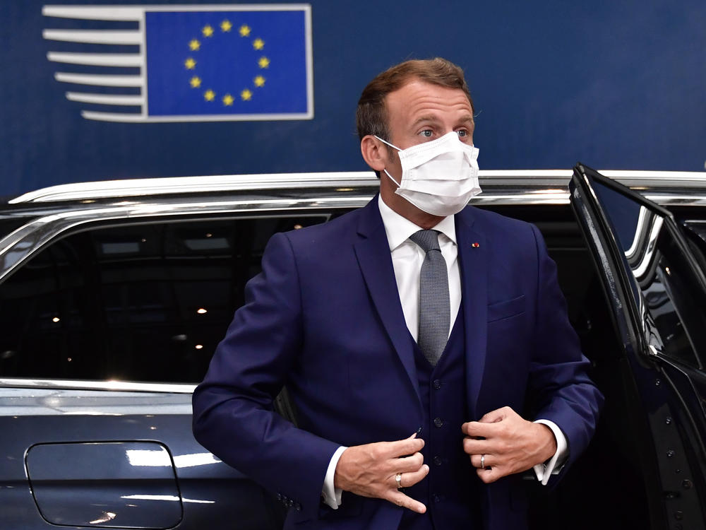 France's President Emmanuel Macron arrives Friday for a European Union meeting in Brussels, where leaders of the 27-member bloc will hold their first face-to-face summit since the pandemic to discuss a COVID-19 economic rescue plan.