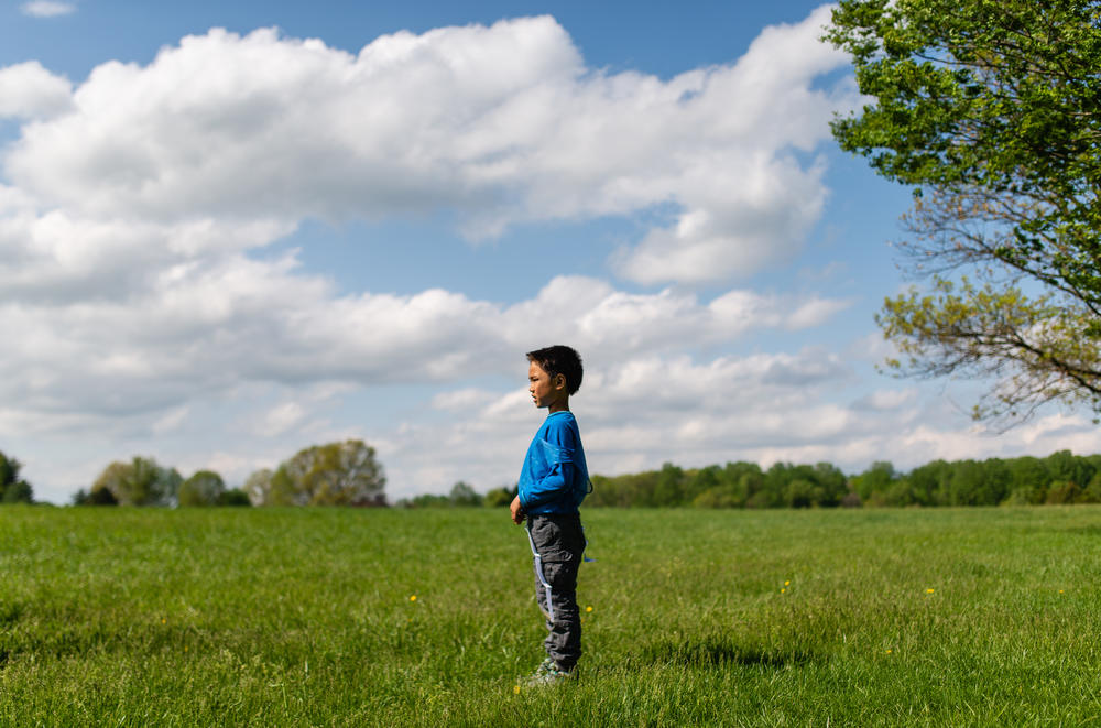 Henry watches his friends play football at Hayle's birthday on April 28, 2019 in Darnestown, Md.