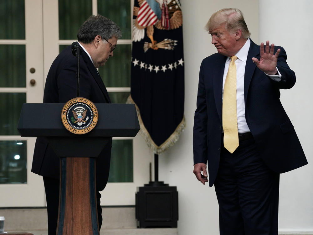 President Trump departs a July 2019 press conference on the census with U.S. Attorney General William Barr (center) and Commerce Secretary Wilbur Ross in the White House Rose Garden.