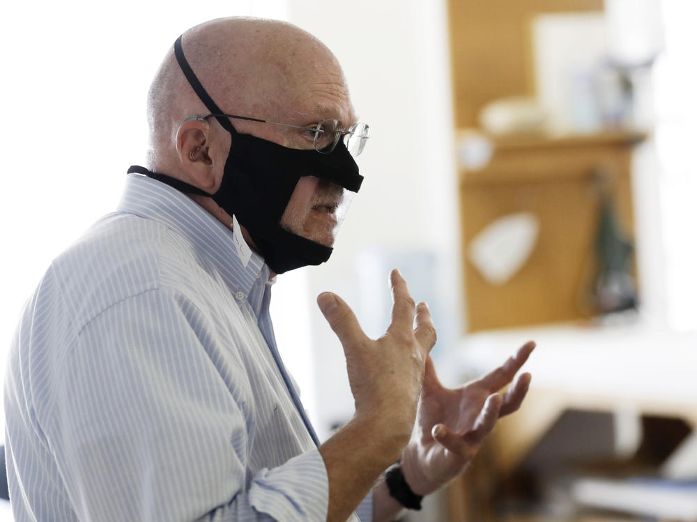 Michael Conley, who is deaf, models a mask that has a transparent panel in San Diego on June 3. Face coverings can make communication harder for people who rely on reading lips, and that has spurred a slew of startups and volunteers to make masks with plastic windows.