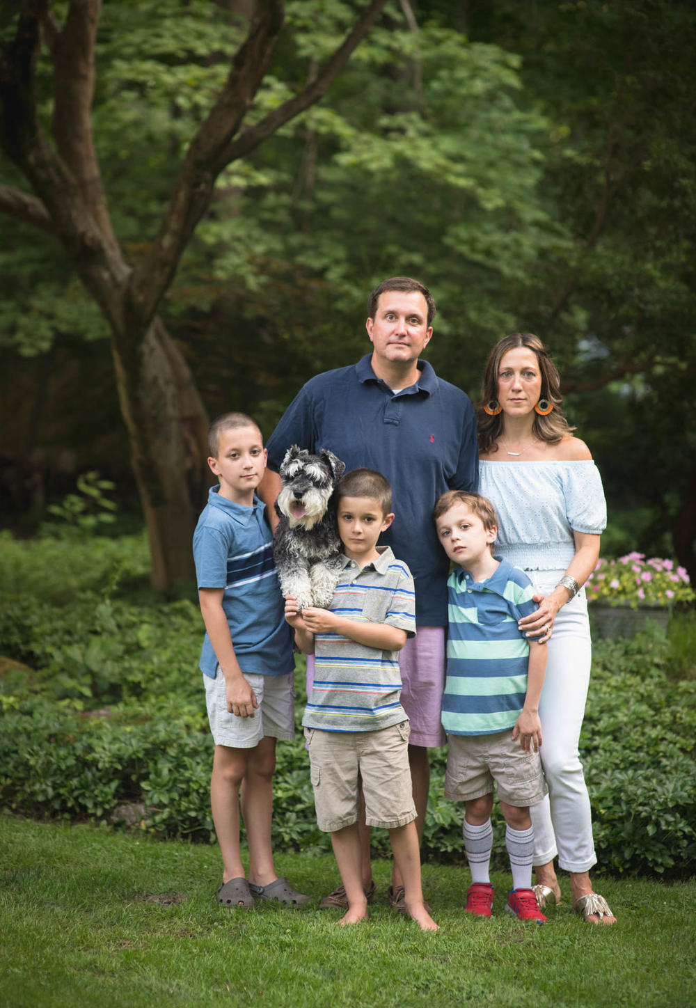 Parents Christopher and Jessica Curran at home in Connecticut with their sons (from left) Kyle, Will and Conner.