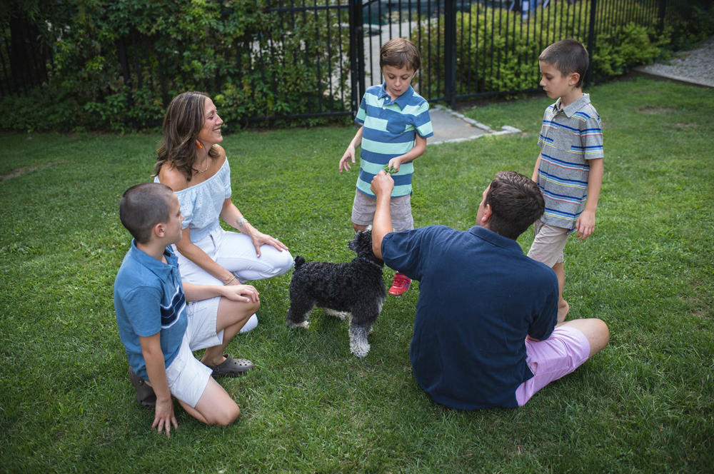 The Curran family (from left): Kyle, 9, Jessica, Conner, 9, Chris and Will, 7, with their dog Hunter, a miniature schnauzer. Pfizer is planning a much larger study for later this year of the same treatment Conner got, and other companies are now working on different types of gene therapy to treat Duchenne muscular dystrophy.