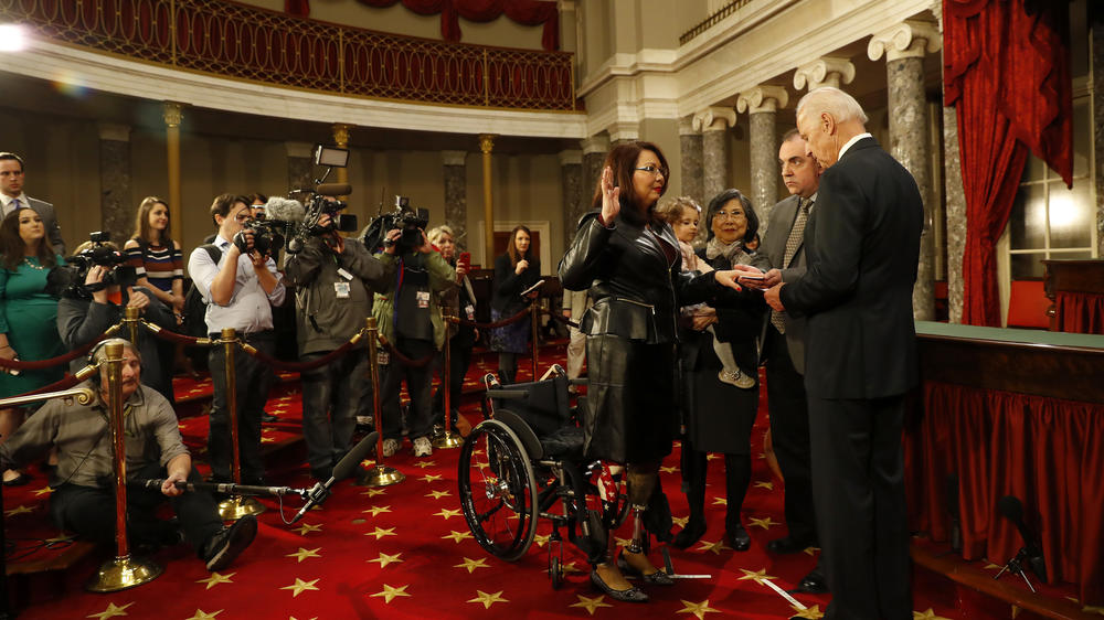 Then-Vice President Joe Biden participates in a reenacted Senate swearing-in with Duckworth in early 2017.