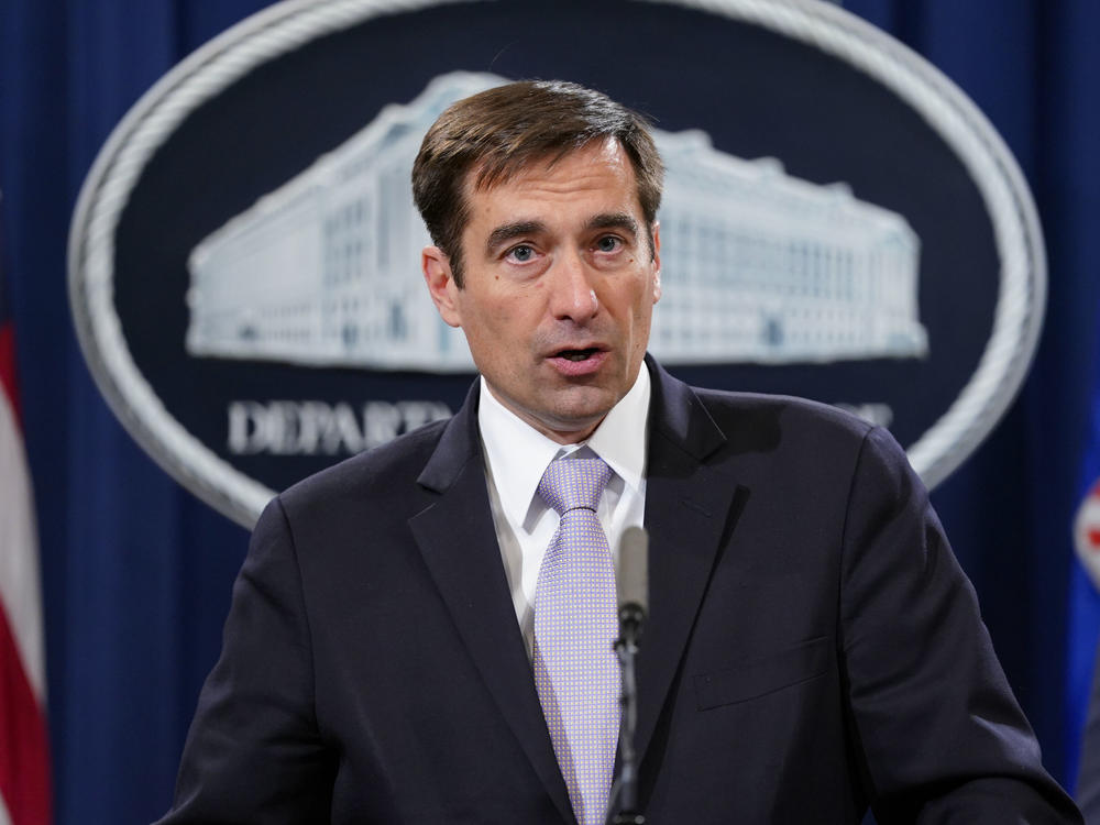 John Demers, assistant attorney general for national security, announces a law enforcement case involving China in November 2018. The Justice Department is prosecuting more alleged cybercrime cases.