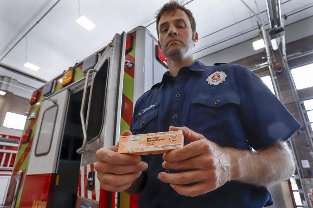 Fire medic Paul Drouhard shows a box containing naloxone that is carried in all the department's emergency vehicles. The drug commonly called Narcan is used primarily to treat narcotic overdoses. 