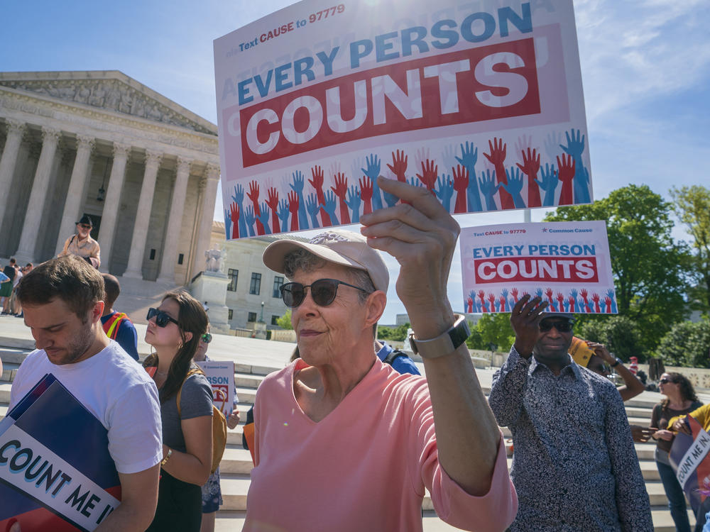 Demonstrators rally outside the U.S. Supreme Court in April 2019 to protest against the Trump administration's efforts to add the now-blocked citizenship question to the 2020 census.